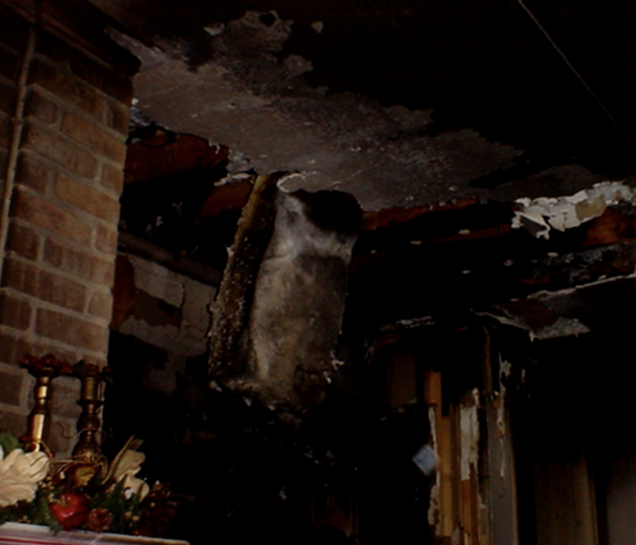 Fire damaged walls and ceiling.