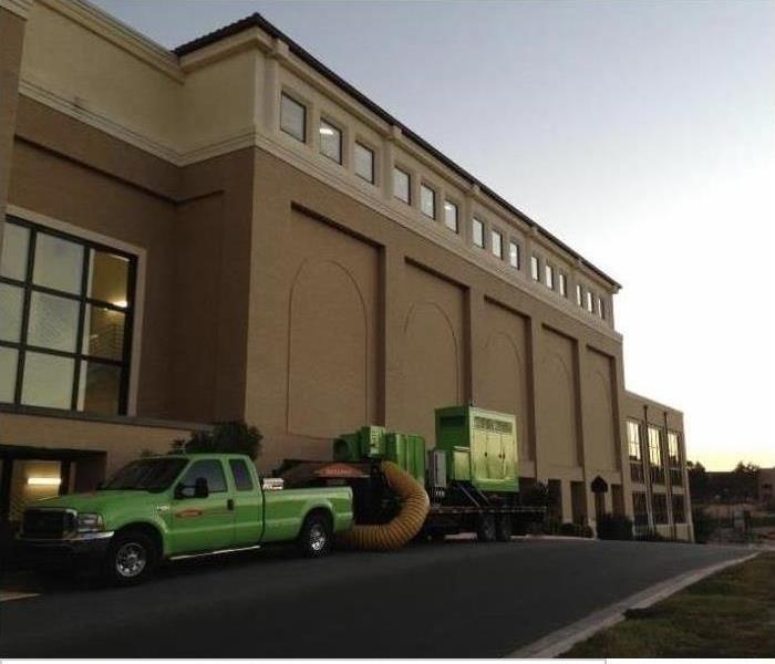 SERVPRO truck and large loss equipment outside of large commercial property.